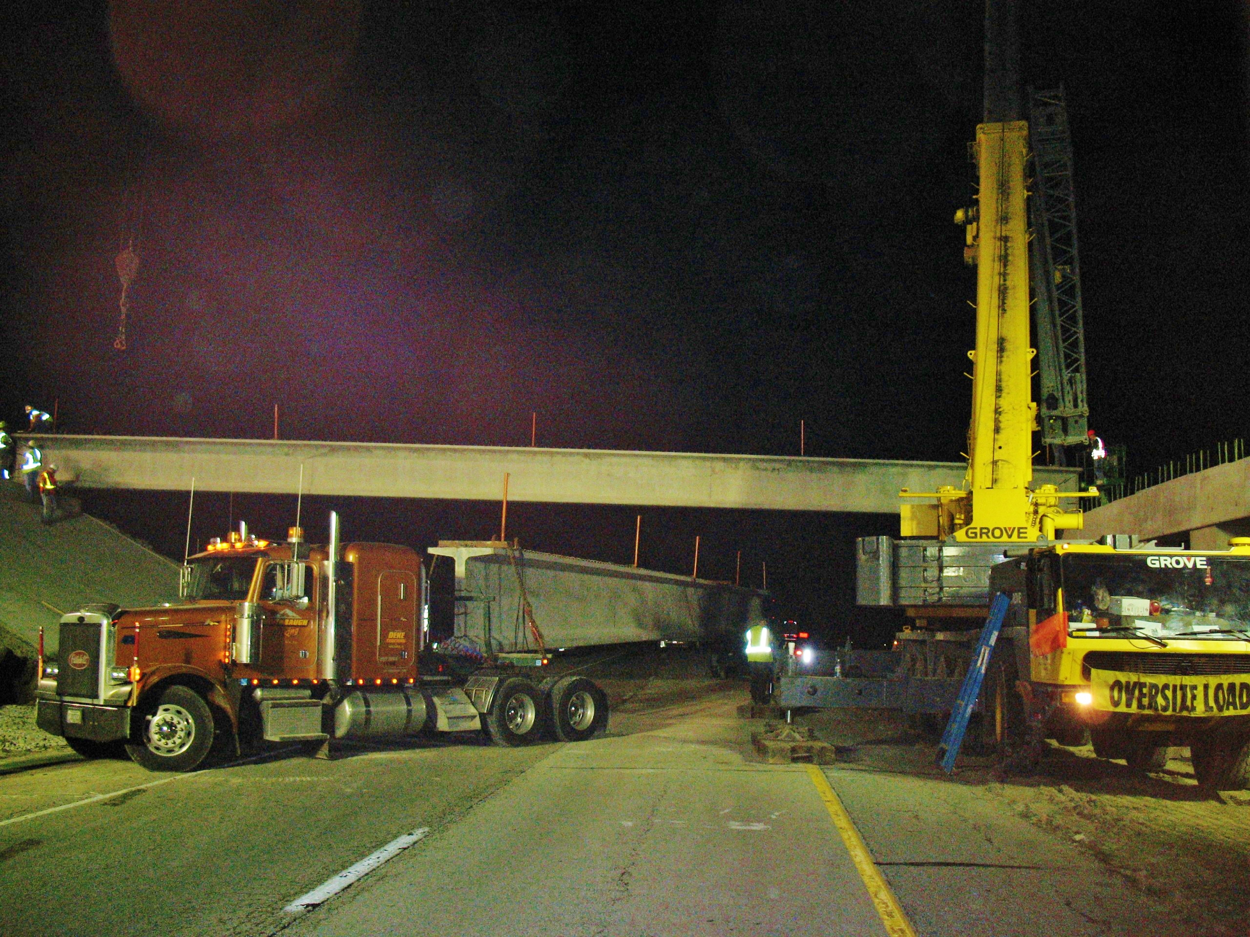 175 ton hydraulic crane hoisting bridge beams on Interstate 57.