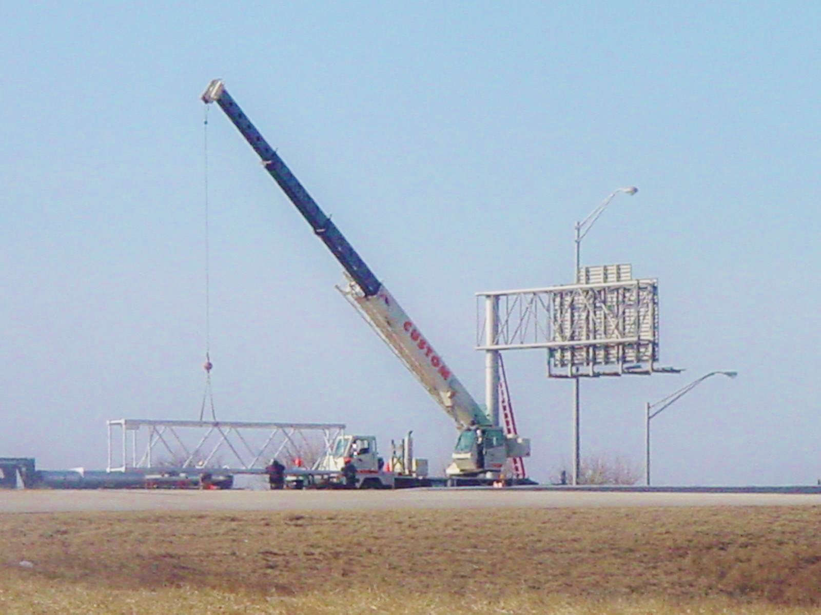 30 ton crane is assisting with a new highway sign.