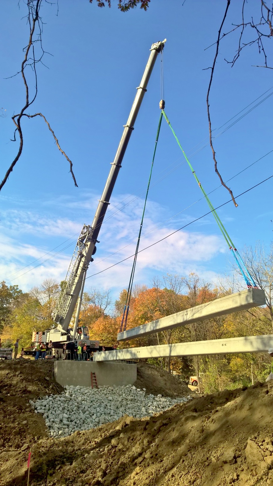 Bridge beams being set by a 275 ton crane in Oakwood, IL.