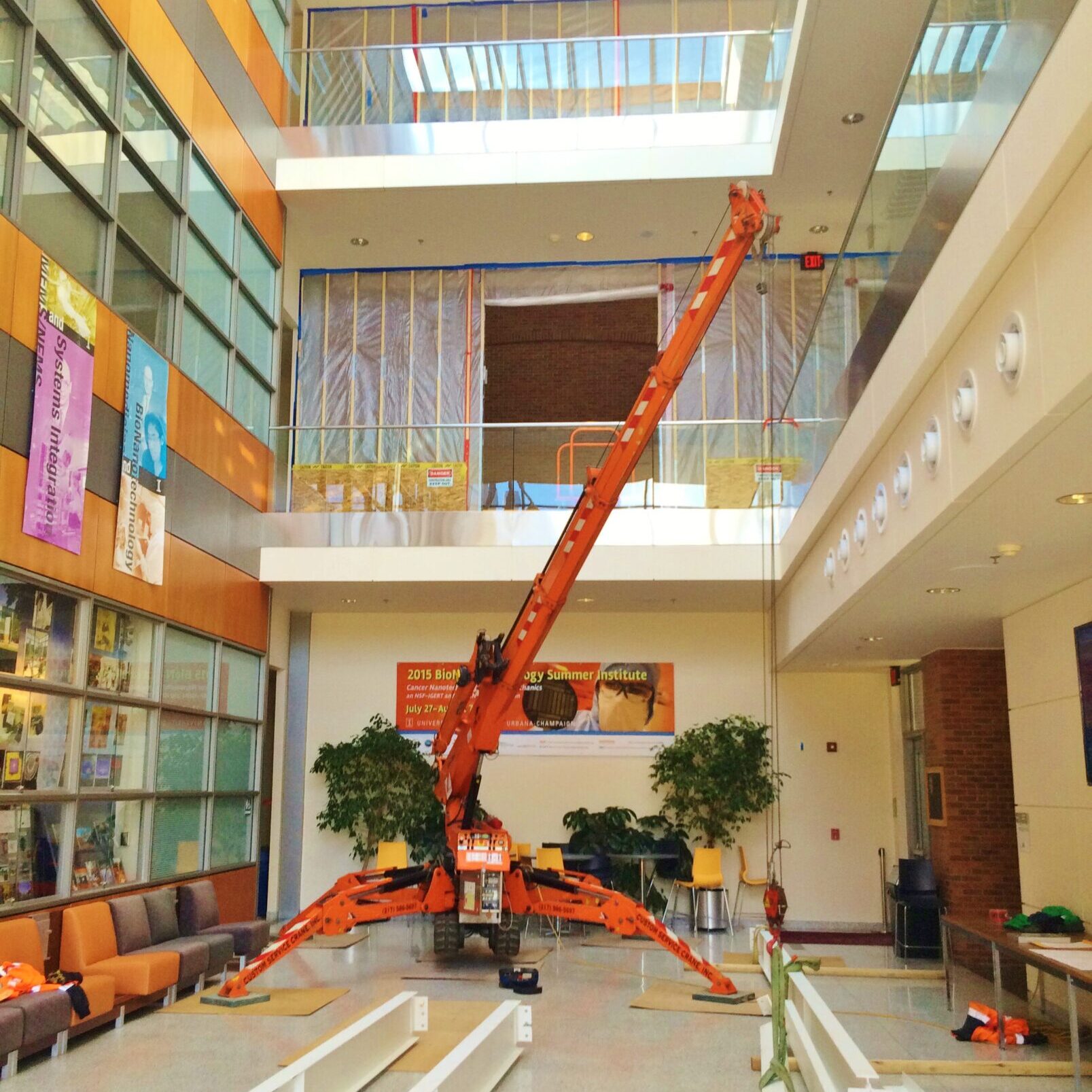 IMG_5174 Jekko mini crane lifting beams inside an academic building.
