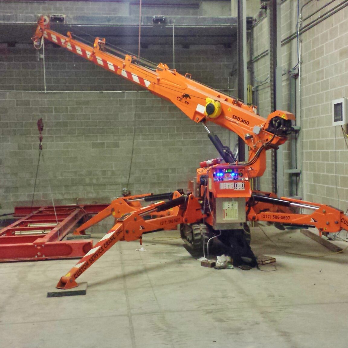 SPD_AS-092716 Jekko mini crane is installing an automated parking garage in Champaign, IL.